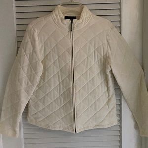 White zip front quilted fall or winter jacket.